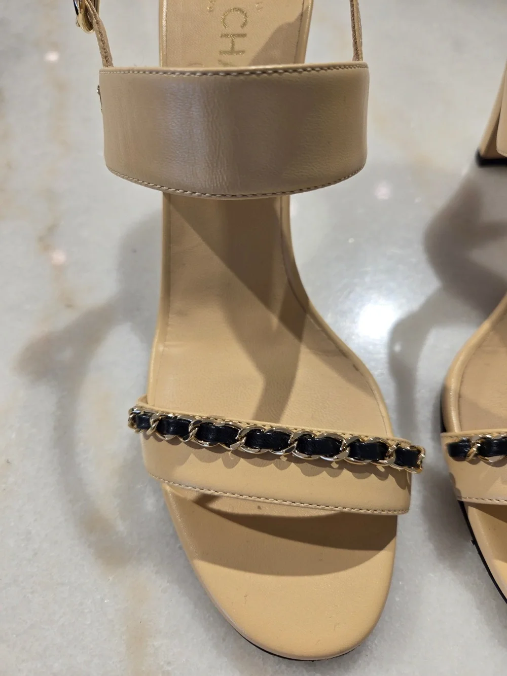 CHANEL Beige Slingback Heels with Black-and-Gold Chain